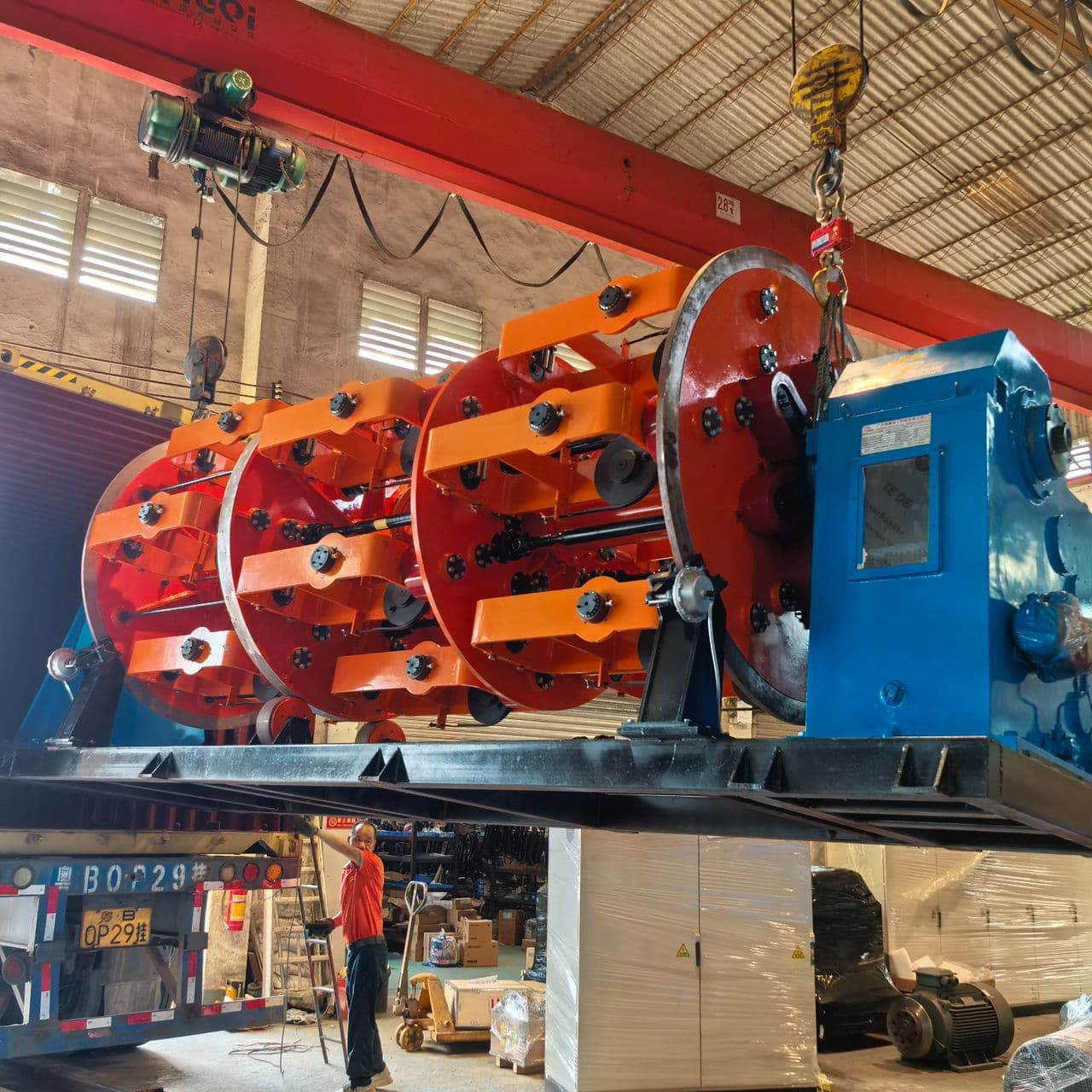 Large production machine being loaded onto a truck