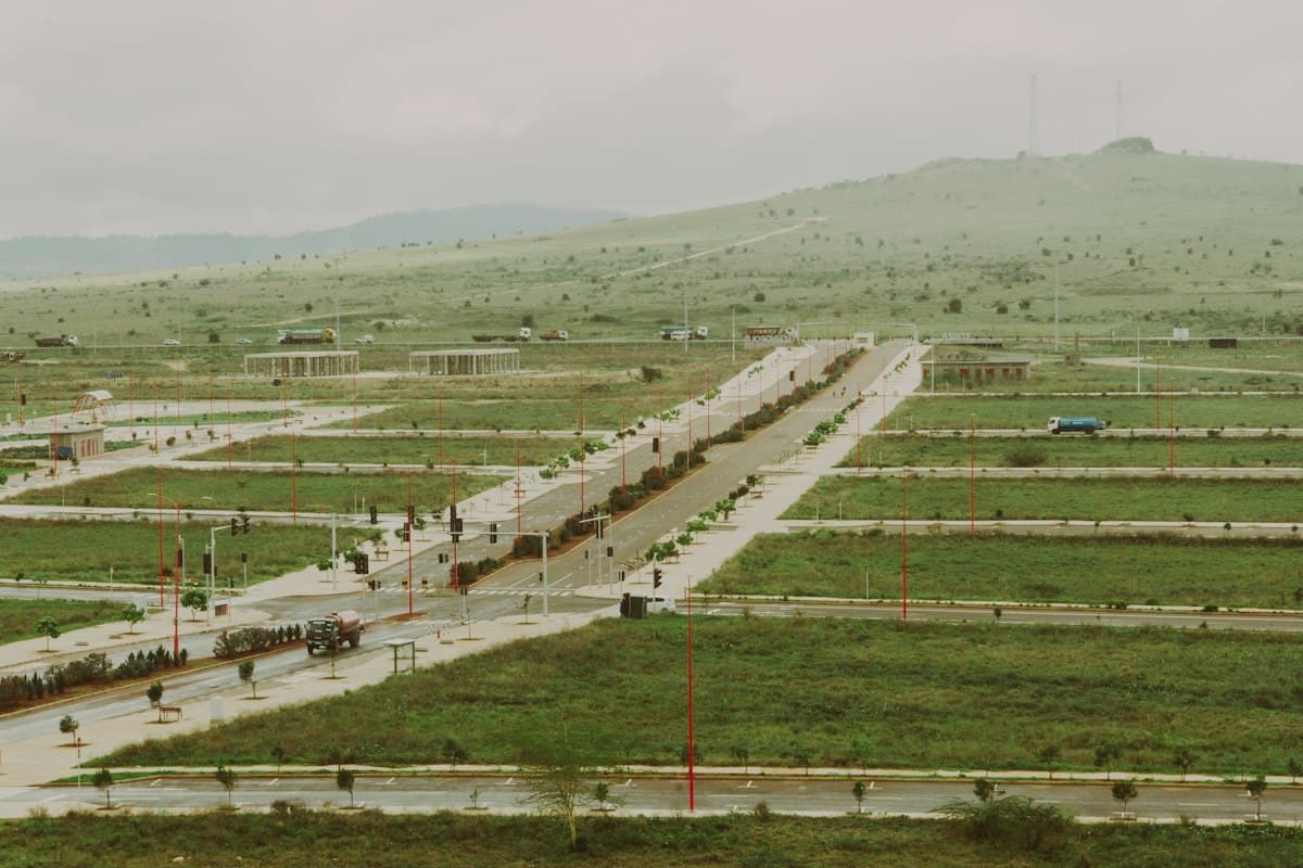 Aerial view of a new development with marked-out plots and access roads