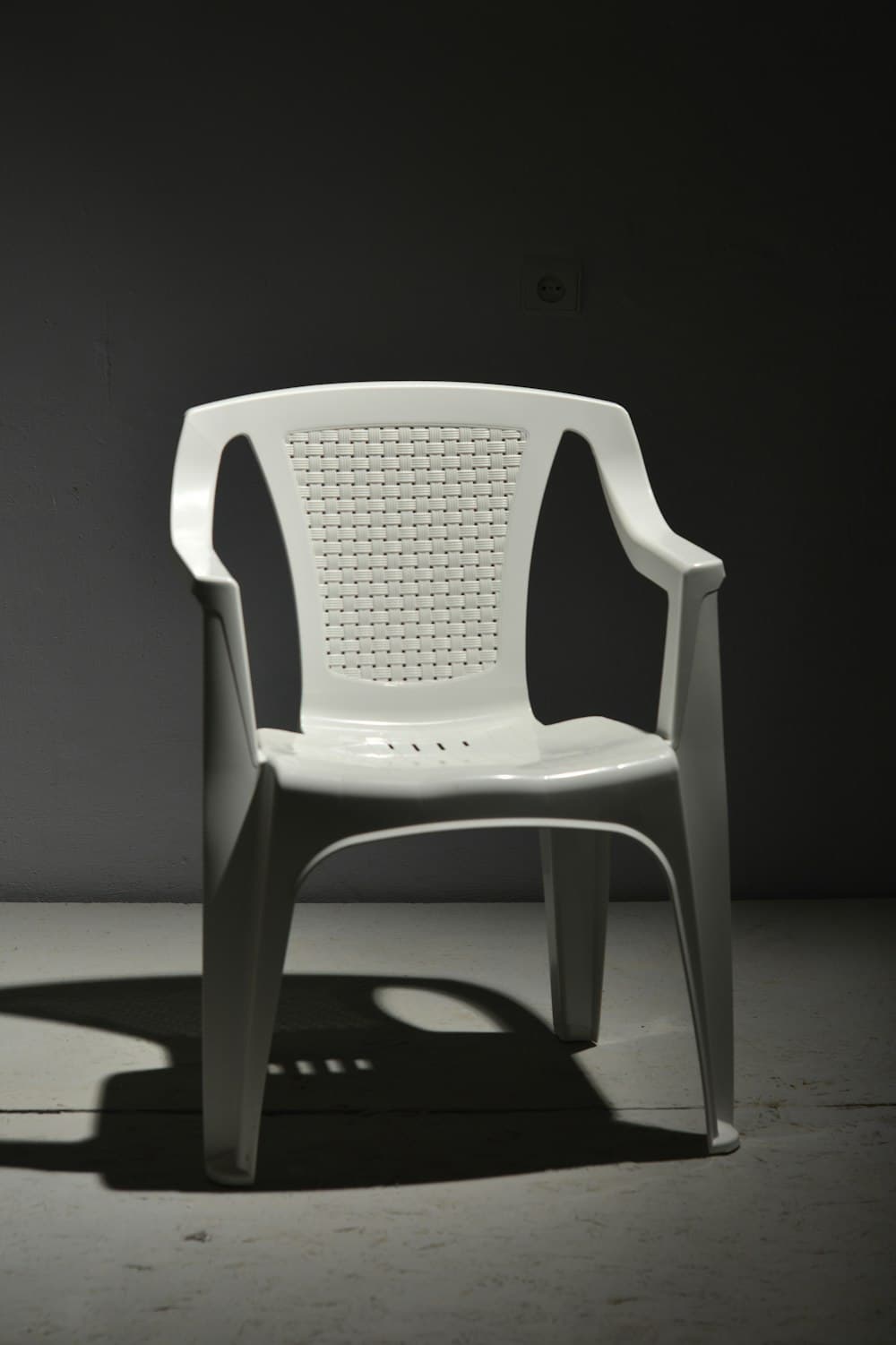 White moulded plastic armchair