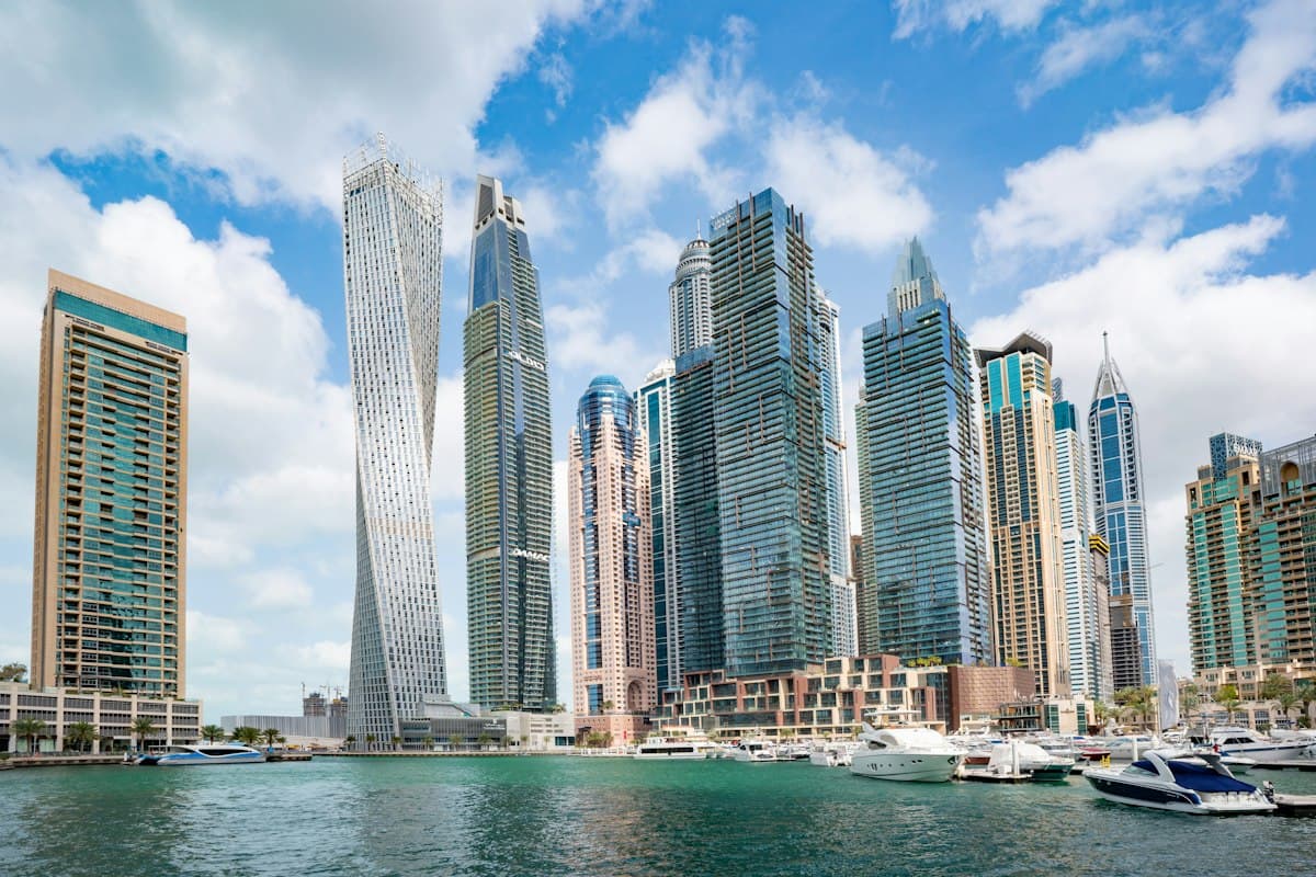 High-rise residential towers beside a marina in Dubai