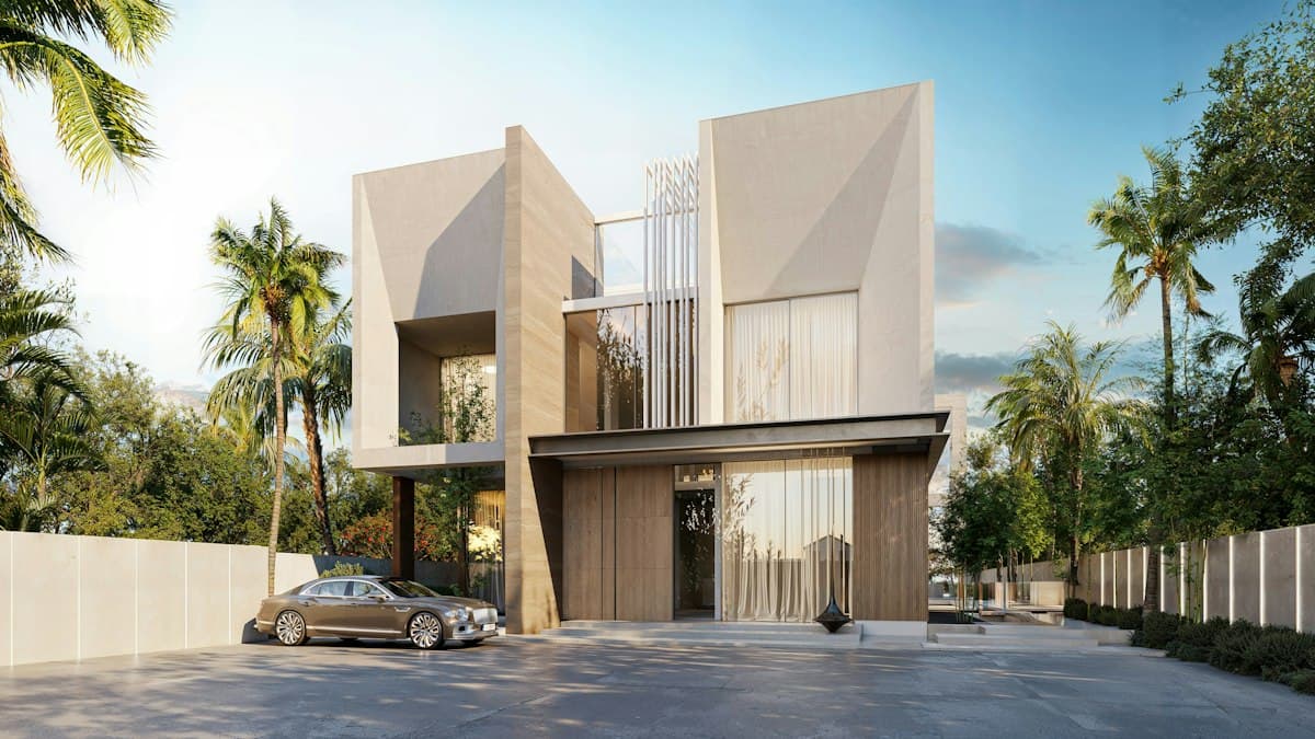 Modern two-storey villa with a stone facade and palm trees